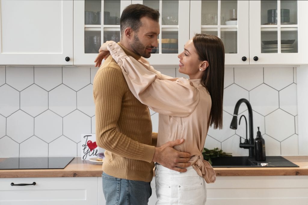 Couple practicing 10-second hug as part of 30-day marriage micro-experiment.