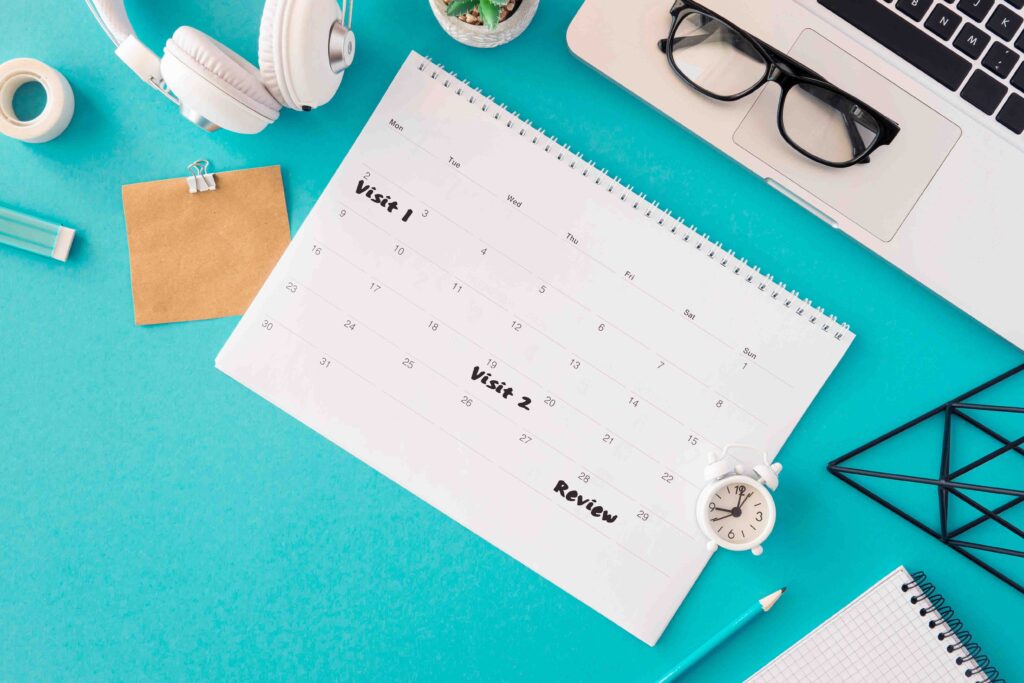 wall calendar marked with progress checkpoints to show relationship repair plan