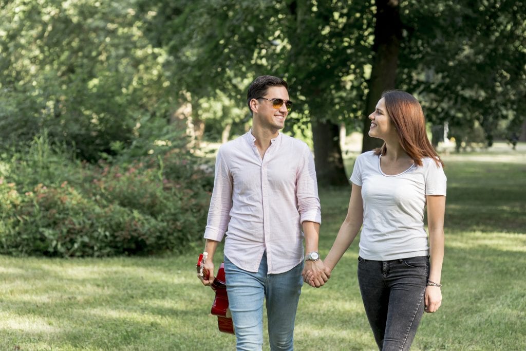 Couple walking peacefully together, guided by their shared marriage style guide.
