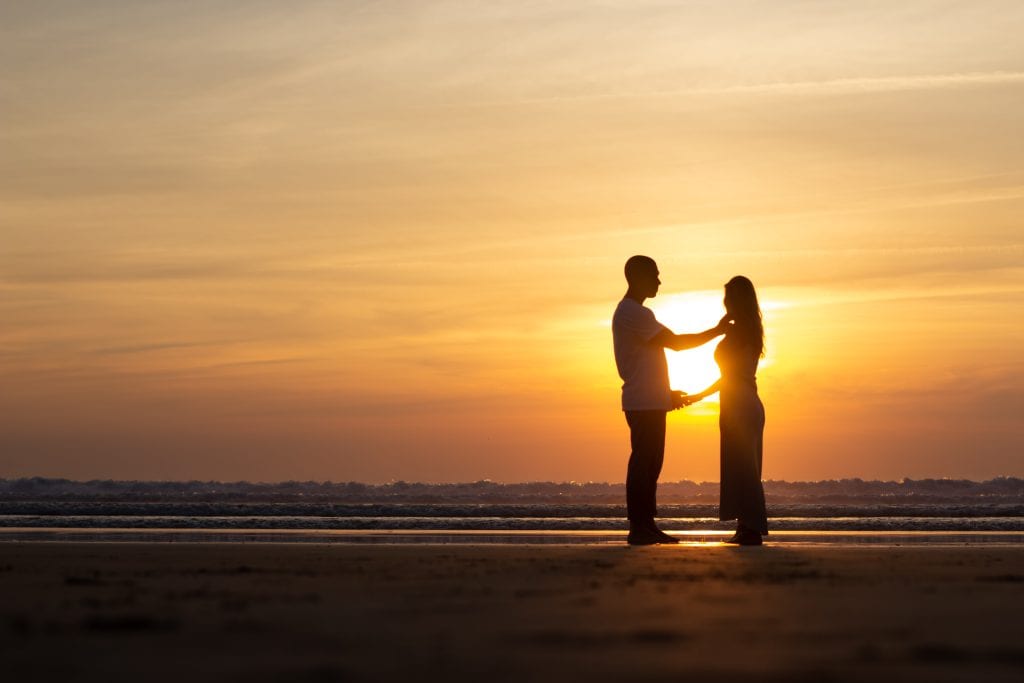 Couple standing strong and peaceful, symbolizing freedom through alignment
