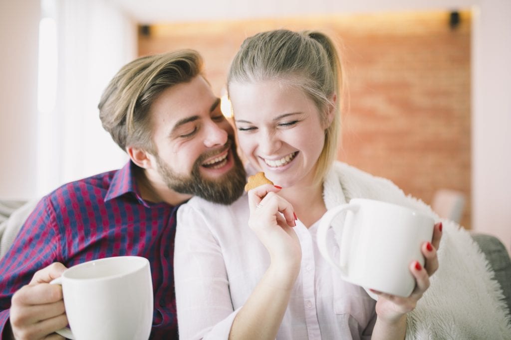 Couple enjoying morning coffee representing daily connection.