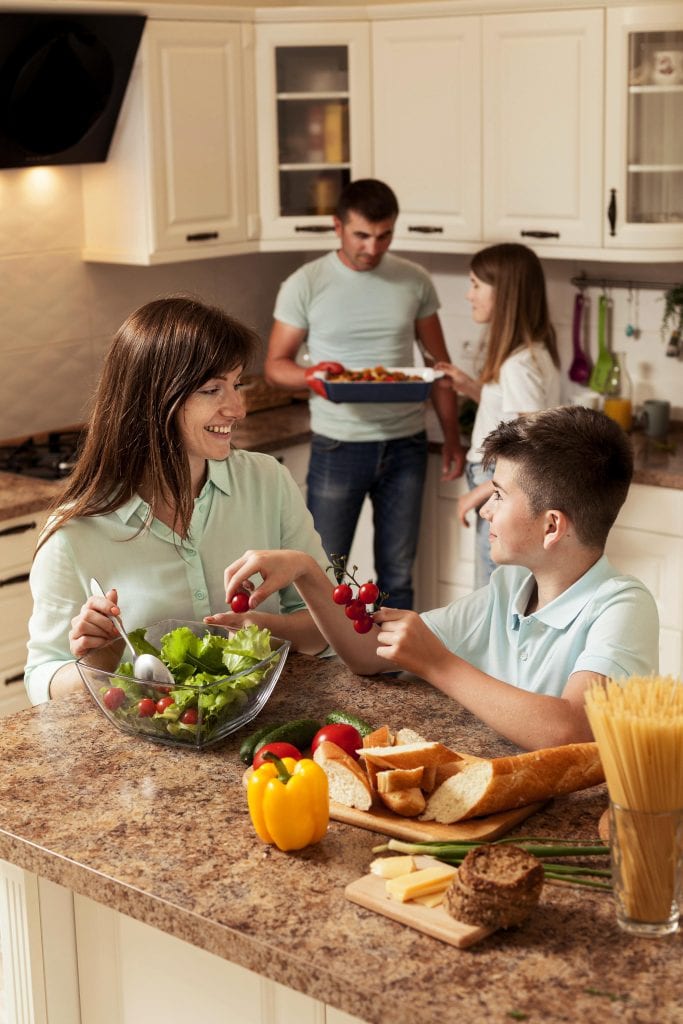 Family preparing food together symbolizing generational gratitude and joy.