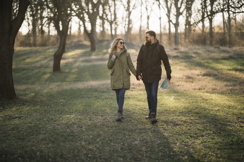 Spouses reconnecting emotionally through calm evening walks after stressful weeks.
