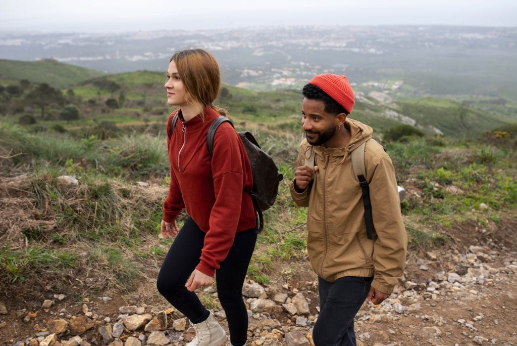 Couple hiking symbolizing proactive emotional fitness.