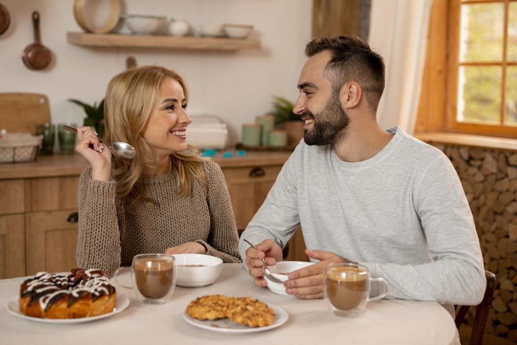 Couple sharing warmth and gratitude during a calm morning.