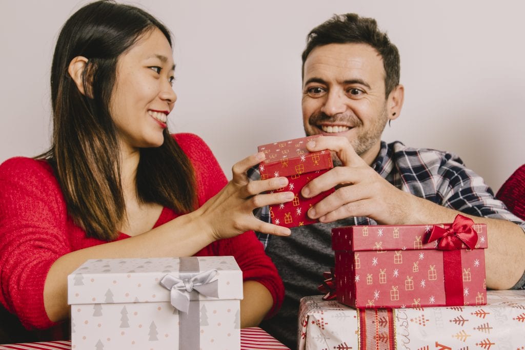 Couple sharing thoughtful gifts showing appreciation and gratitude.