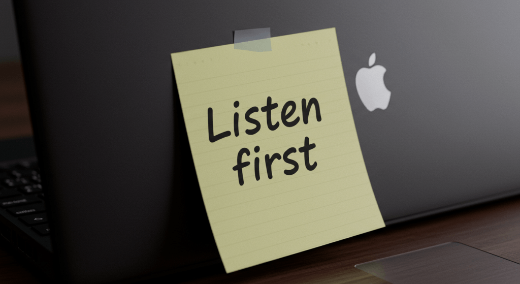 Sticky note with the words “Listen first” as a simple reminder to stop talking over your spouse