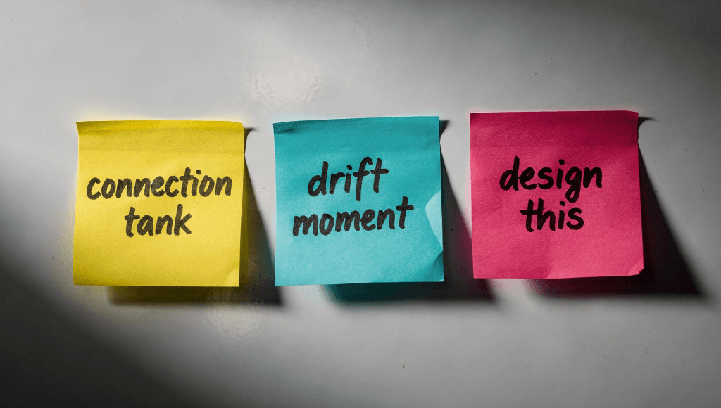 Colorful sticky notes with shared language phrases, helping a couple practice connection by design