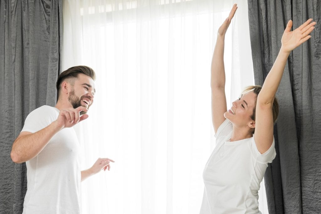 Married couple testing one of their best marriage ideas with a simple, fun dance experiment at home.