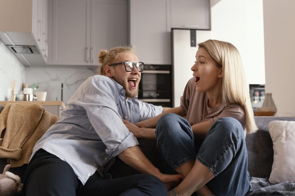Husband and wife having a tender conversation where one is vulnerable and the other is listening with care.