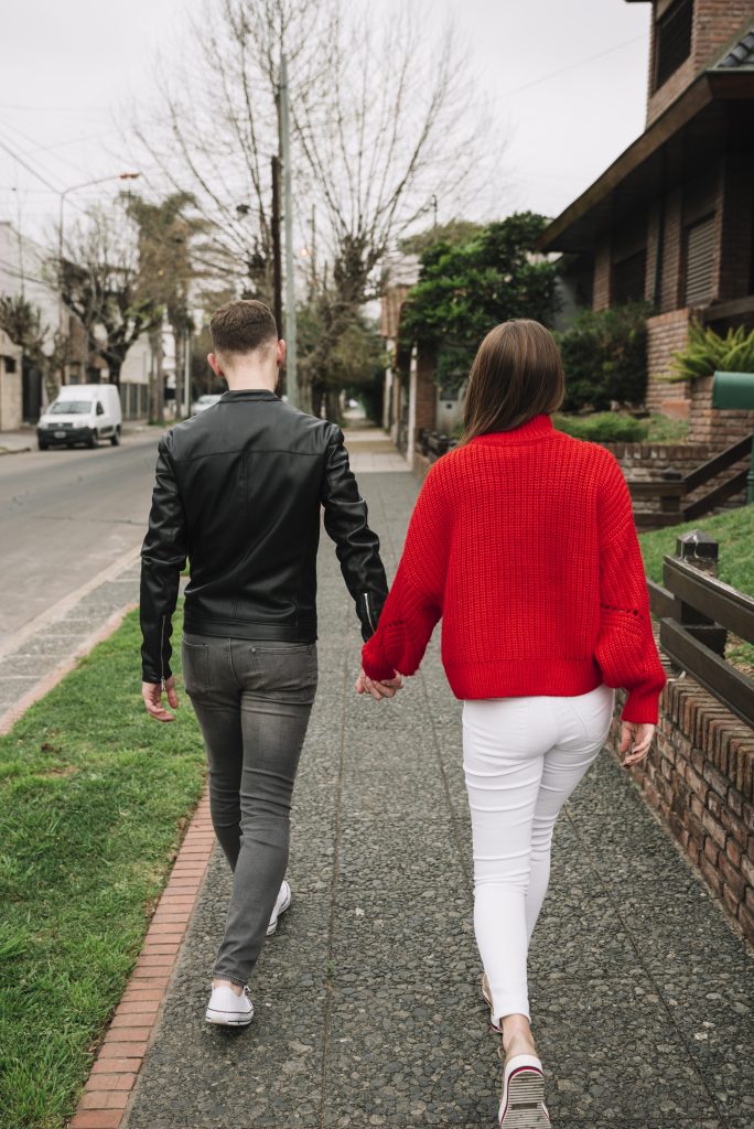 Married couple enjoying a walk together as a weekly ritual, symbolizing consistent emotional connection