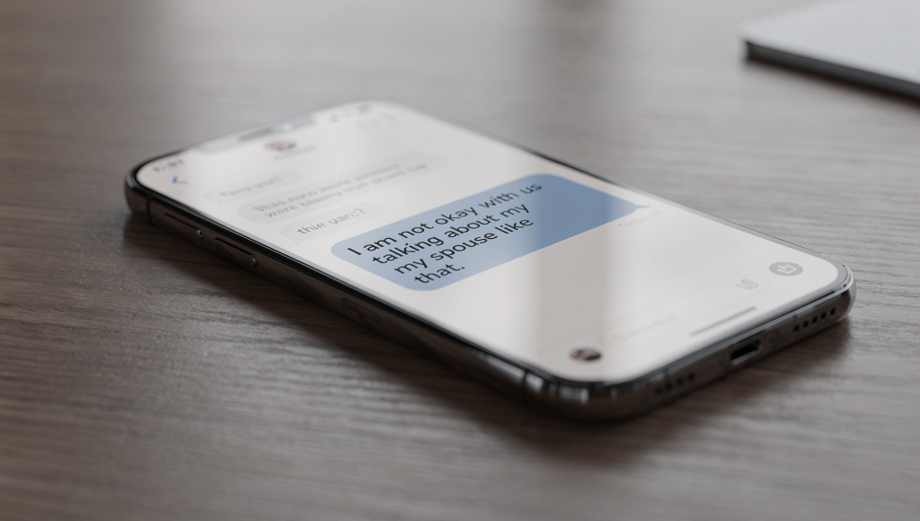 Spouse using the United Front Conversation in a text message to respond when family criticizes their partner.