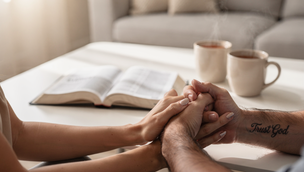 Couple praying together before using the United Front Conversation so they can say exactly what they need to with the right heart.