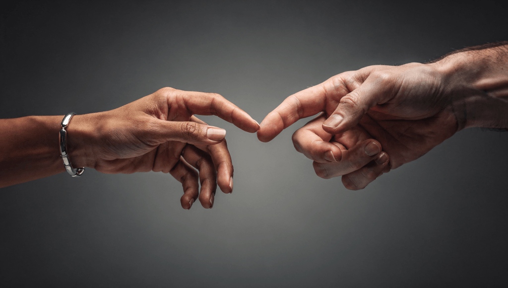 Two hands reaching toward each other symbolizing marriage disconnect from in-law interference