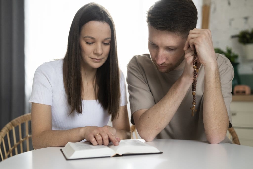 Christian couple seeking God's guidance on family pressure and marriage unity